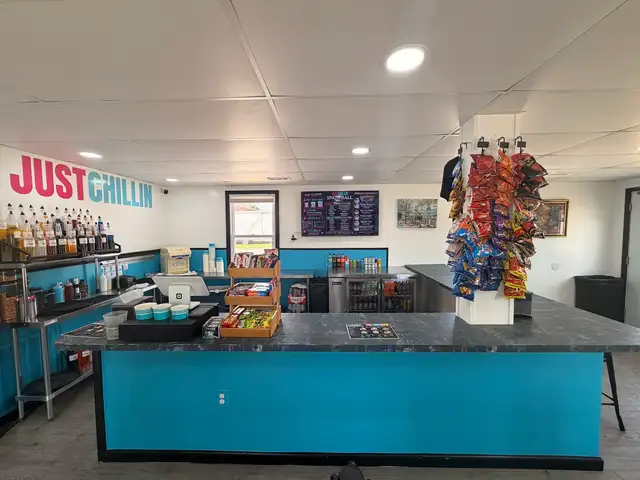 The Just Chillin service counter with the shop logo sign above it