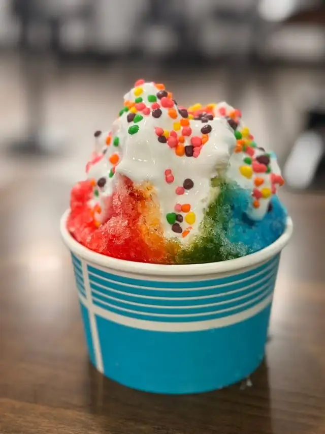 A Double Rainbow specialty snowball in bright rainbow colors